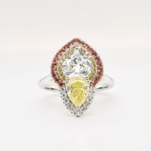 Diamond Ring with Yellow/Orange Sapphire Set in Platinum