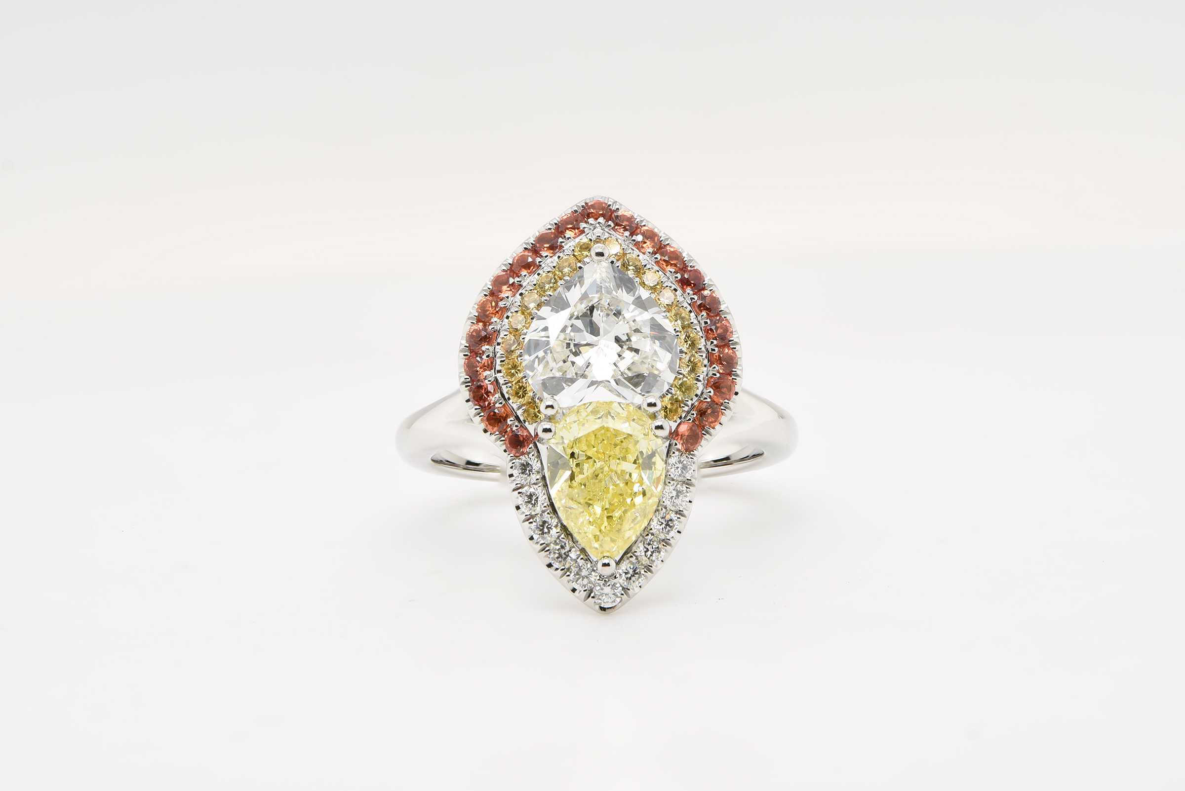 Diamond Ring with Yellow/Orange Sapphire Set in Platinum
